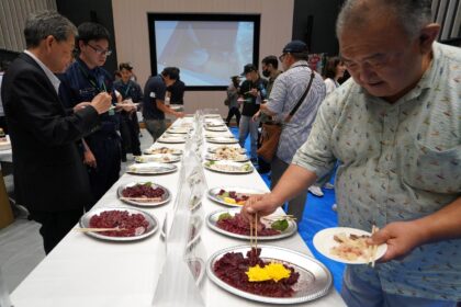 Guests taste processed products an exhibition aimed at promoting whale meat in Tokyo's Toy