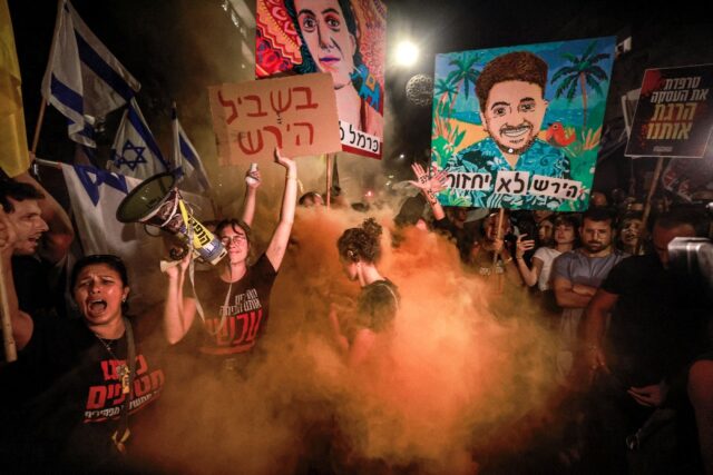 Israeli demonstrators at an anti-government protest calling for action to release Gaza hos