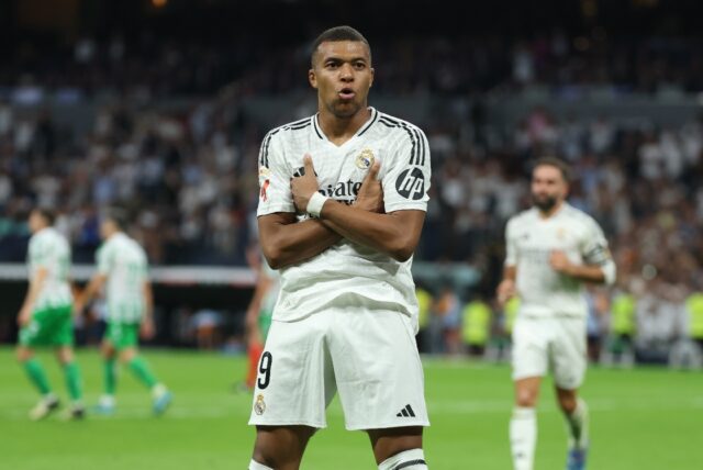 Kylian Mbappe celebrates scoring his team's second goal from the penalty spot during Liga