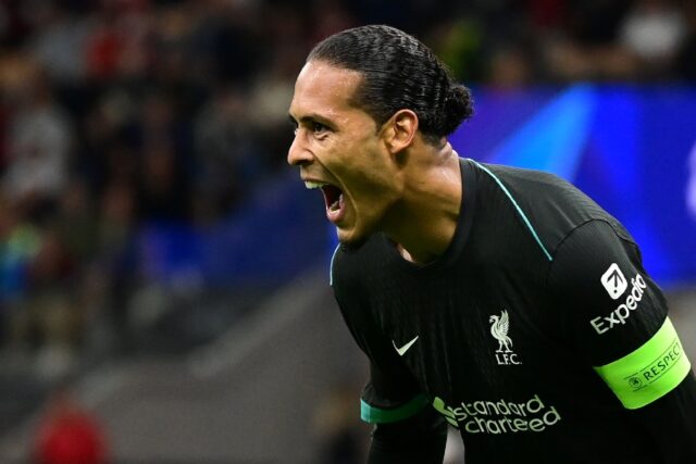 Liverpool defender Virgil van Dijk celebrates scoring against AC Milan