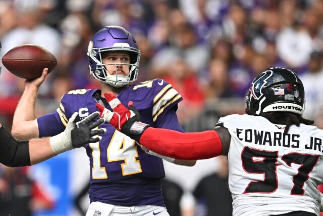 Minnesota Vikings quarterback Sam Darnold passes the ball as Mario Edwards Jr. of the Hous