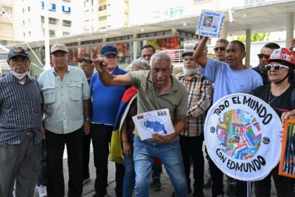 Opposition protesters shout slogans at a small gathering in Caracas on September 28, 2024