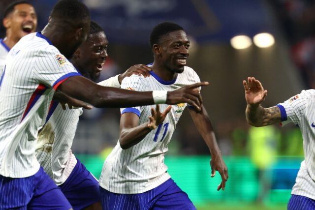 Ousmane Dembele (C) celebrates with teammates after scoring France's second goal against B