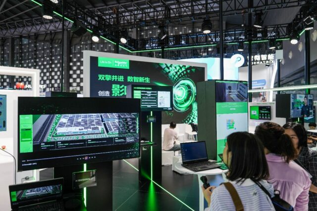 People visit a booth during the World Artificial Intelligence Conference (WAIC) in Shangha