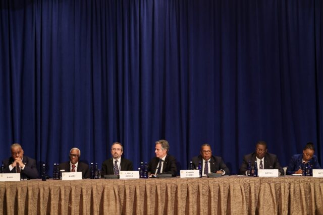 President of the Haitian Transitional Presidential Council Edgard Leblanc Fils (2L) speaks