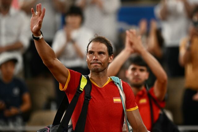 Rafael Nadal (L) and teammate Carlos Alcaraz after their elimination in the doubles at the