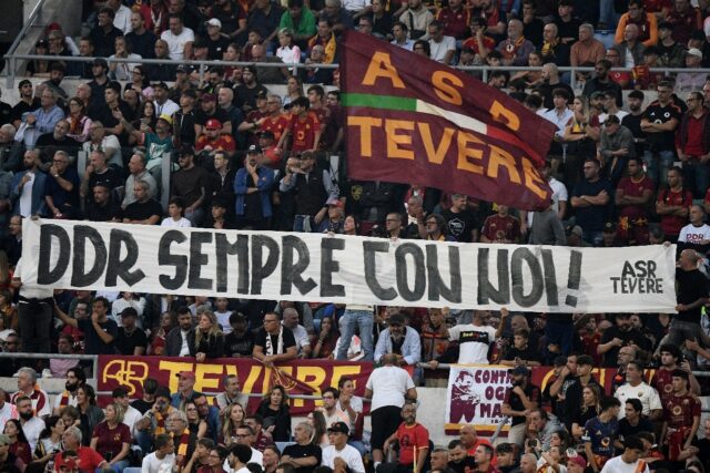 Roma supporters hold a banner reading "Daniele De Rossi always with us" during Sunday's 3-