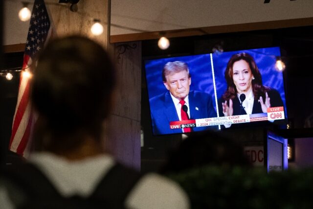 A screen displaying the US Presidential debate between Vice President and Democratic presi