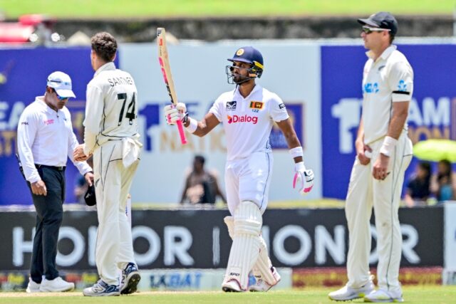 Sri Lanka's Dinesh Chandimal celebrates reaching fifty against New Zealand in Galle