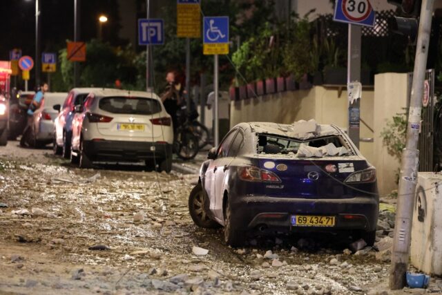 A street in Tel Aviv after it was hit by a rocket fired from the Gaza Strip on October 7,