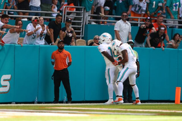 Tyreek Hill celebrates a touchdown by pretending to be handcuffed in Miami's 17-14 win ove