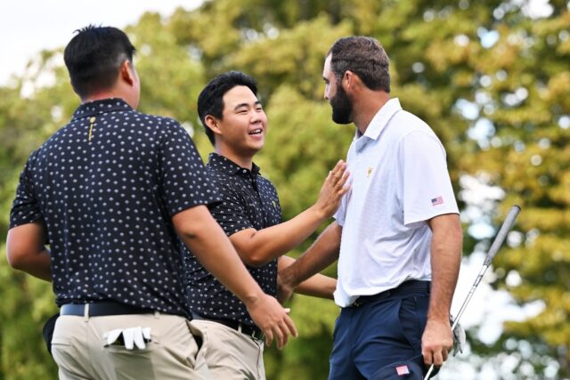 US star Scottie Scheffler, right, shakes hands with pal Tom Kim of South Korea after a US