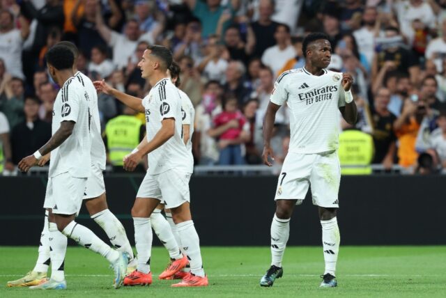 Vinicius Junior (R) celebrates scoring his Real Madrid's third goal against Espanyol