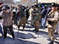 Afghan cameramen cover a protest against U.S. President Joe Biden in Kabul, Afghanistan, T