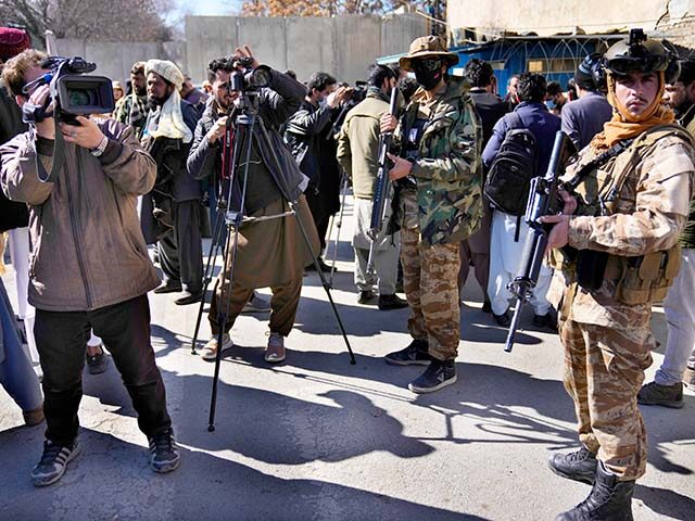 Afghan cameramen cover a protest against U.S. President Joe Biden in Kabul, Afghanistan, T