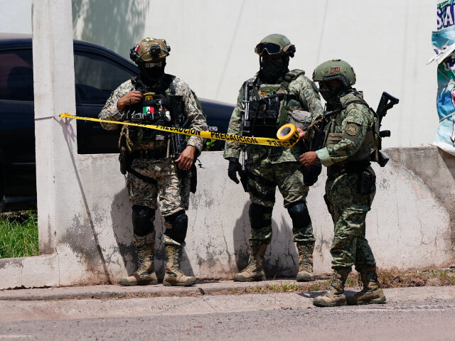 Soldiers cordon off a neighborhood during an operation in Culiacan, Sinaloa state, Mexico,