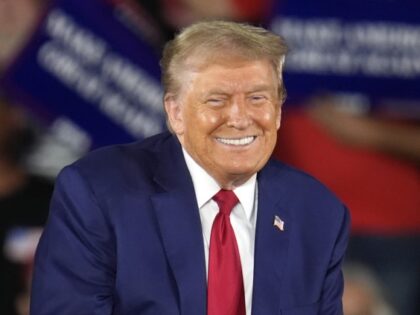 Republican presidential nominee former President Donald Trump smiles during a town hall ev