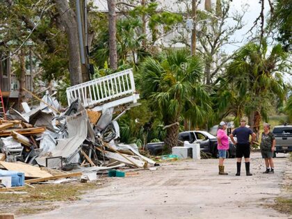 Frankie Johnson, left, and her husband, Mark Johnson, talk with fellow resident Charlene H