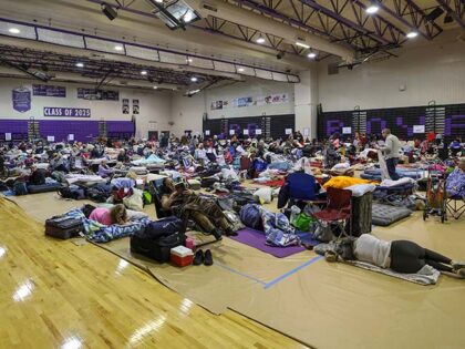 A view of some of the 700 evacuees in the gymnasium in shelter at River Ridge Middle/High