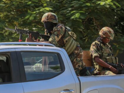 Soldiers patrol amid the sound of gunshots heard in the distance, in Port-au-Prince, Haiti