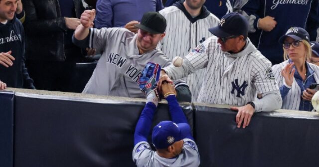 WATCH: Yankees Fan Tries to Tear the Glove Off Mookie Betts' Hand