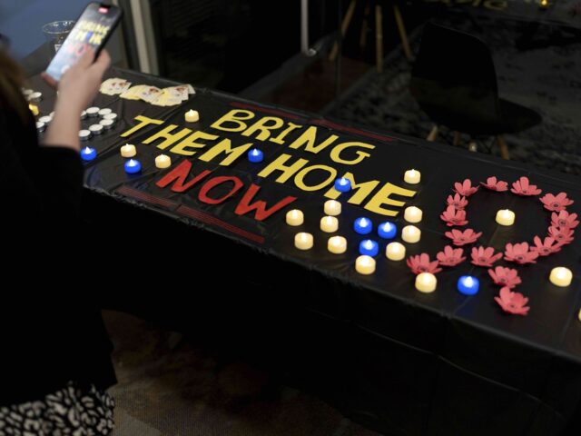 A message to bring home hostages still held by Hamas is spelled out on a table following a