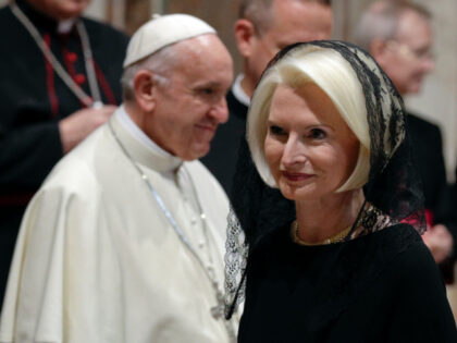 U.S. ambassador to the Holy See Callista Gingrich walks past Pope Francis during an audien