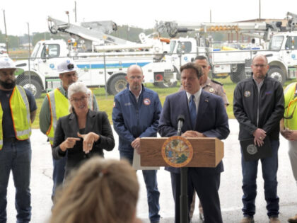 46th Governor of Florida, Ron DeSantis speaks to press during his visit to a logistics sta