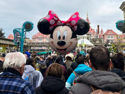 PARIS, FRANCE - APRIL 29: People spend their time at Disneyland Paris, which welcomes mill