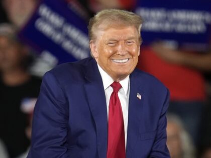 Republican presidential nominee former President Donald Trump smiles during a town hall ev