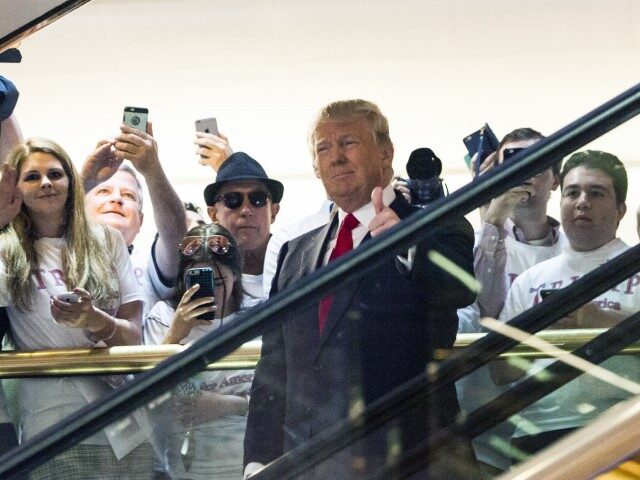 Business mogul Donald Trump rides an escalator to a press event to announce his candidacy