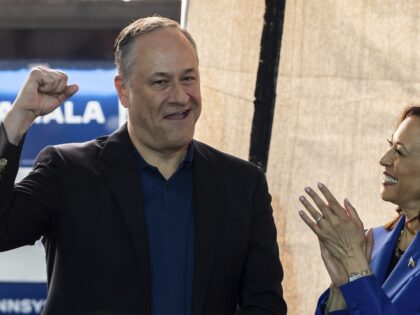 Democratic presidential nominee Vice President Kamala Harris looks at second gentleman Dou