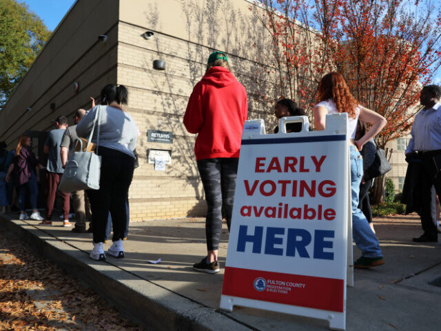 ATLANTA, GEORGIA - NOVEMBER 04: People wait in line for early voting for the midterm elect