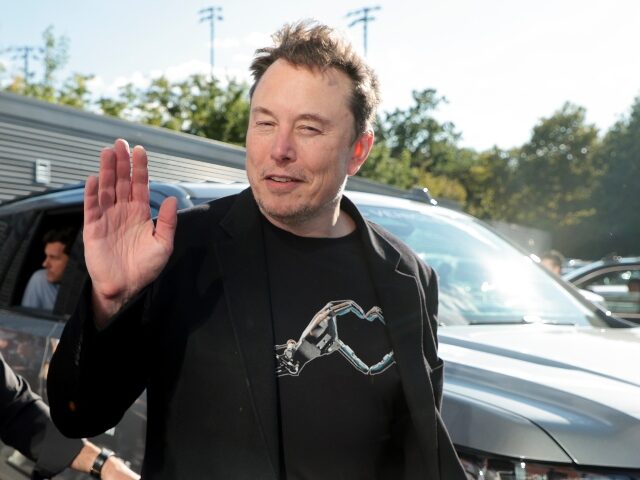 Elon Musk waving to the camera