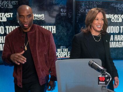 Democratic presidential nominee, Vice President Kamala Harris (R) walks into the studio wi