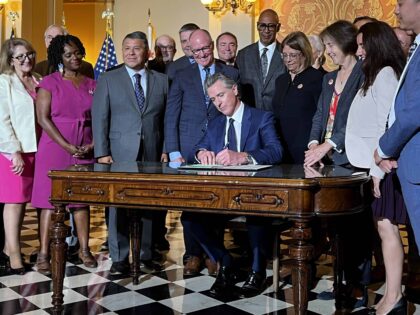 California Gov. Gavin Newsom signs legislation at the state Capitol on Monday, Oct. 14, 20