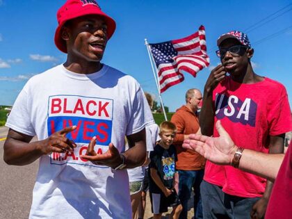 A supporter of the US president wears a "Black Lives MAGA" t-shirt on August 17, 2020 in M