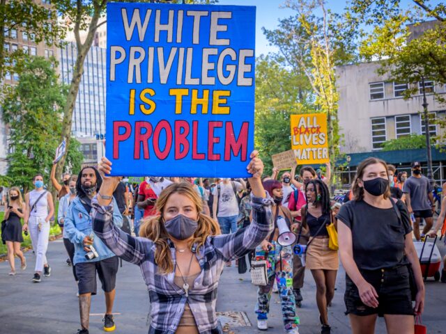 BROOKLYN, NEW YORK, UNITED STATES - 2020/09/05: A participant holding a White Privilege Is