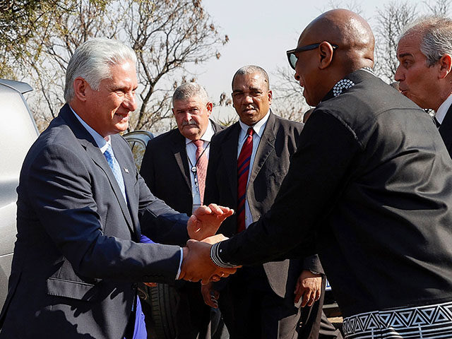 President of Cuba Miguel Diaz-Canel (L) is welcomed by South African Minister of Sports, A