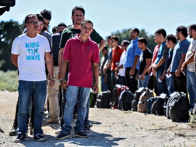 Campo, CA, Monday, June 3, 2024 - Men seeking asylum are detained by border patrol after c