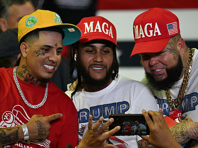 Supporters pose for a photo as they arrive to hear former US President and Republican pres