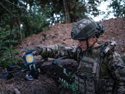 DONETSK OBLAST, UKRAINE - JULY 23: Ukrainian soldier from the 121st brigade prepares a FPV