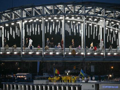 TOPSHOT - Models present creations while walking a catwalk erected along the Passerelle De