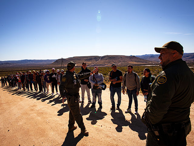 Border patrol officers record the number of the migrants who crossed the U.S.-Mexico borde