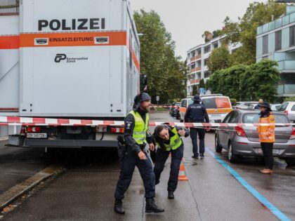 Police officers are seen next to a daycare centre outside where a man attacked several chi