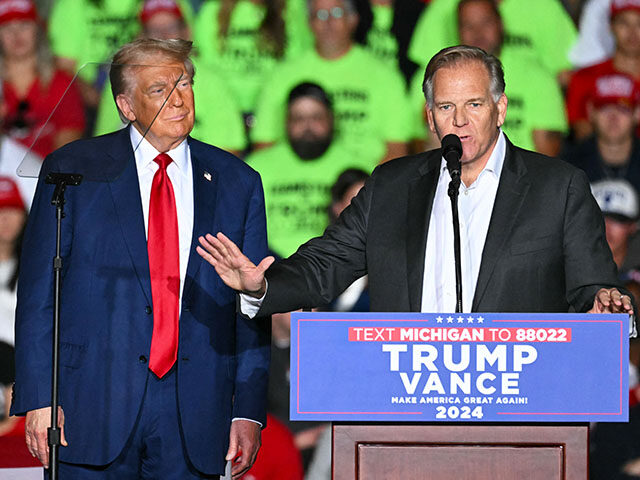 (L-R) Former US President and Republican presidential candidate Donald Trump looks on as M