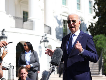 US President Joe Biden speaks to the press before boarding Marine One on the South Lawn of