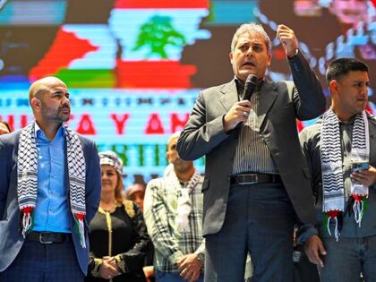 Iran's Ambassador to Venezuela Hojat Soltani (C) speaks during a pro-Palestinian march to