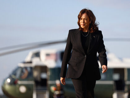 Democratic presidential nominee and Vice President Kamala Harris walks to board Air Force