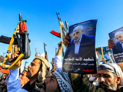 Supporters of Yemen's Huthis gather with pictures of Hamas' slain leader Yahya Sinwar duri